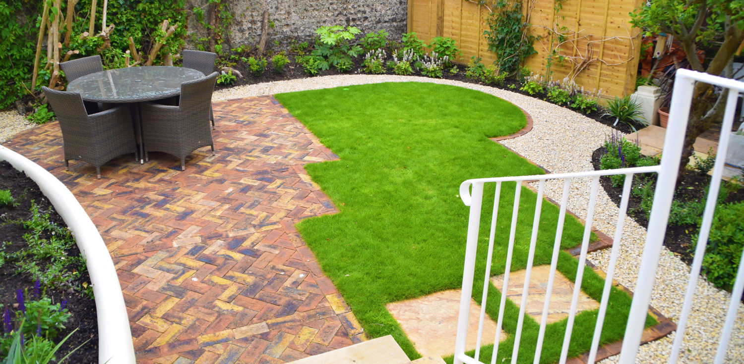 Brighton garden with detailed patio design, lawn and mixed planting.